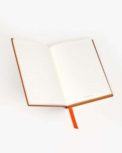 Inside of the Notebook with orange ribbon bookmark.