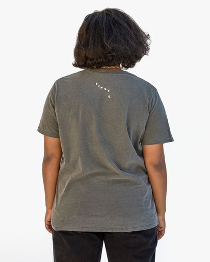 Candice showing the back of the Vive La Resistance Classic Tee.